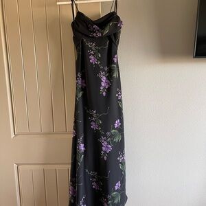Black formal dress with purple flowers and back detail.